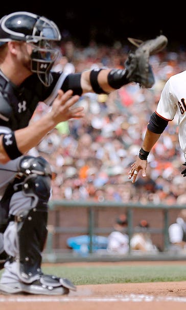 Plate-blocking rule, replay spur Giants past White Sox